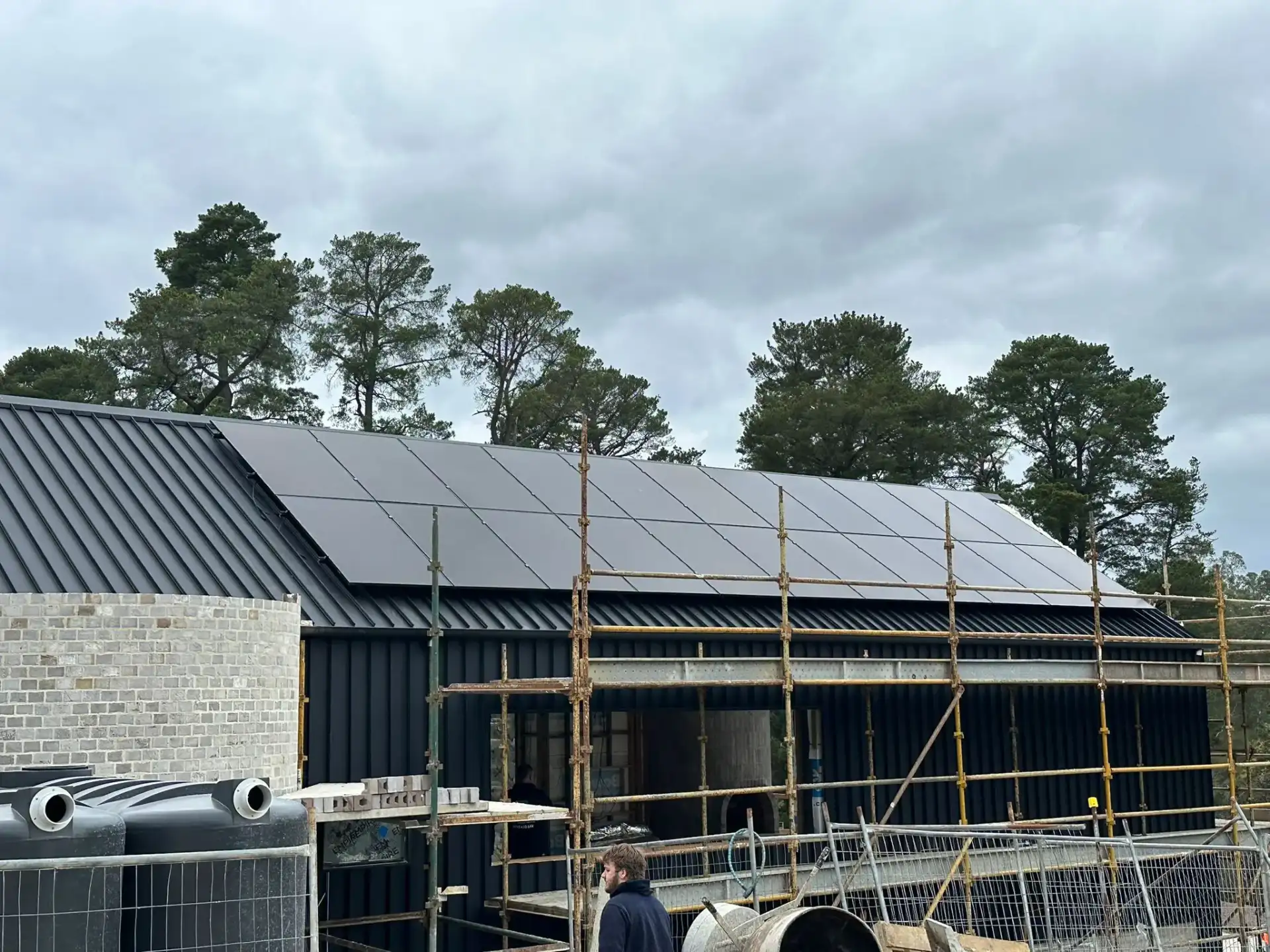 Construction site with solar panel installation in progress
